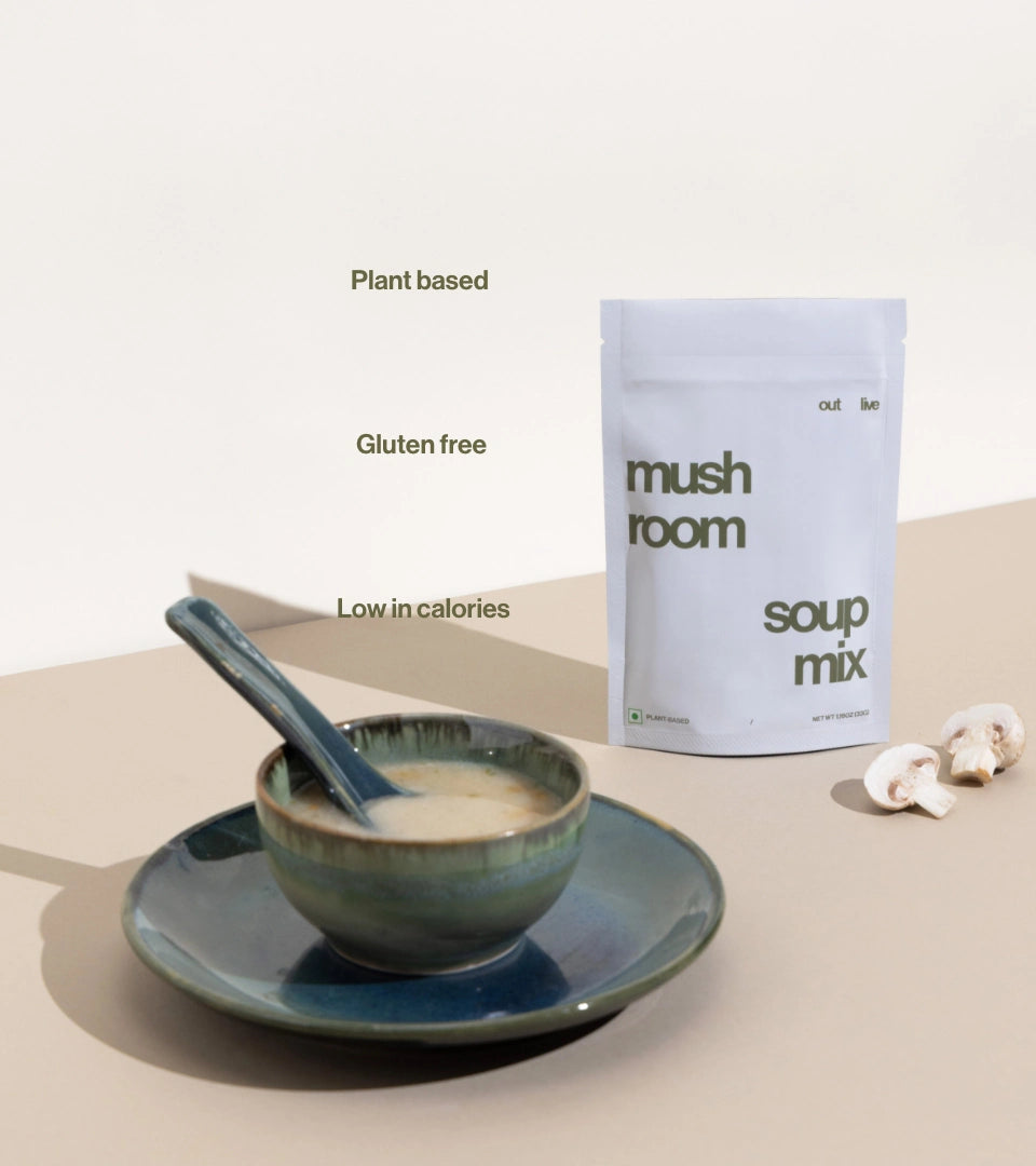 Outlive Mushroom Soup Mix served in a ceramic bowl with a spoon, showcasing its creamy texture.