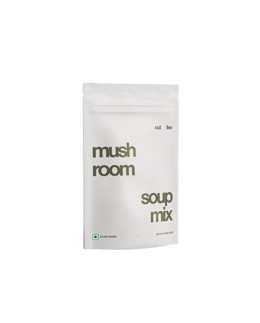 Outlive Mushroom Soup Mix served in a ceramic bowl with a spoon, showcasing its creamy texture. A nutritious meal replacement to support immunity.