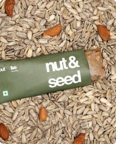 Outlive's Nut and Seed Bar displayed with almonds, chia & sunflower seeds, highlighting its wholesome, natural composition.
