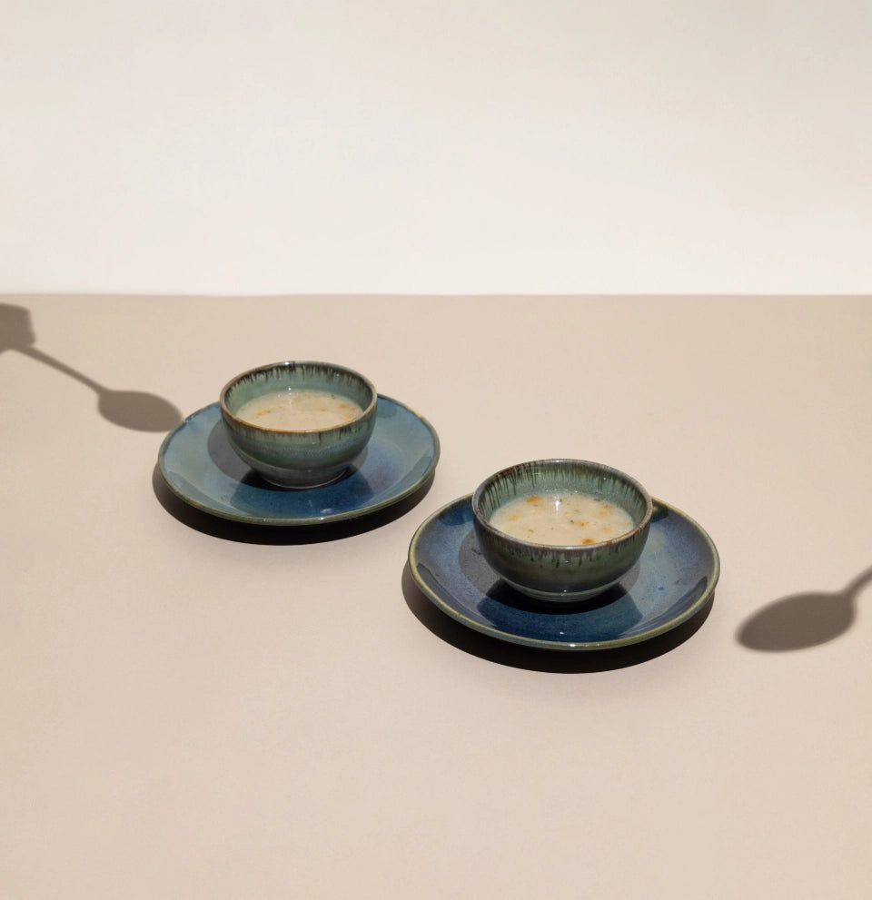 Outlive Mushroom Soup Mix served in a ceramic bowls with a spoon.